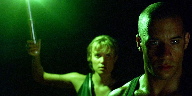 Vin-Diesel-as-Riddick-and-Rhada-Mitchell-as-Carolyn-in-Pitch-Black
