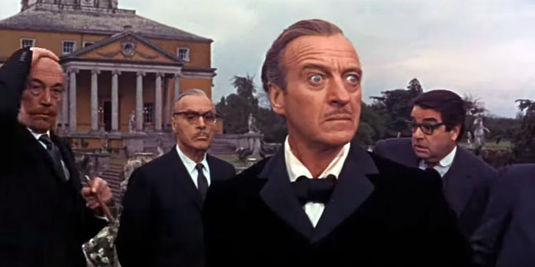 James Bond Looks Alarmed While Standing in front of a Building in Casino Royale