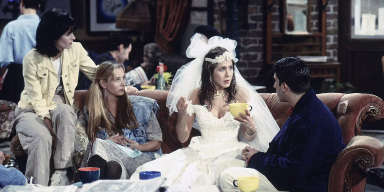 Rachel tells her story to Ross. Monica, Phoebe, Chandler, and Joey after arriving to Central Perk in a wedding dress in Friends