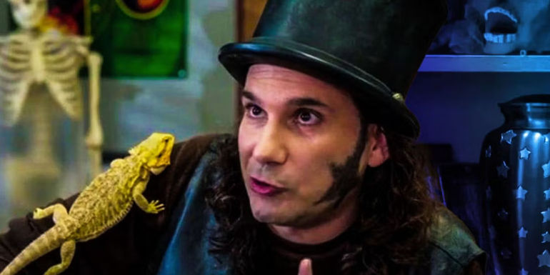 Starburns wears a top hat and has a lizard on his shoulder in Community.