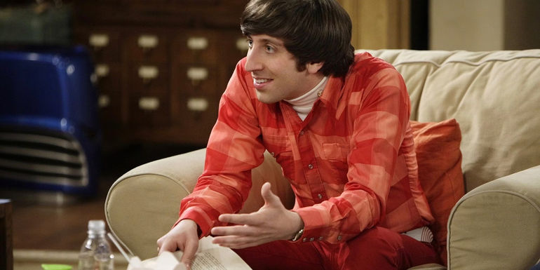 Howard sitting in a chair and talking to people off screen from The Big Bang Theory