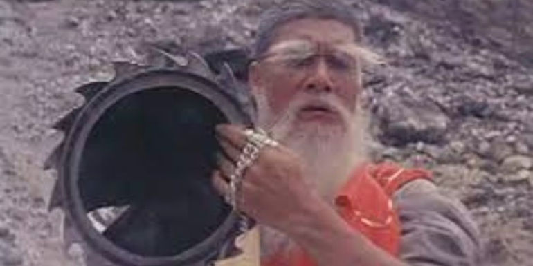 Kam Kong as Fu Sheng Wu Chi in The Master of the Flying Guillotine