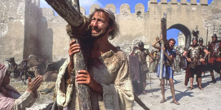Brian carrying a cross in Life of Brian