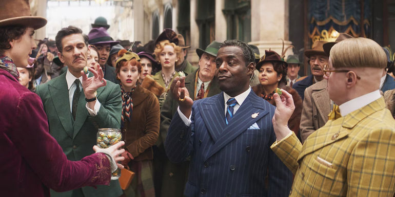 Fickelgruber Slugworth and Prodnose holding hoverchocs in Wonka