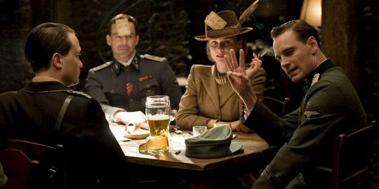 Hicox giving the three finger gesture in the tavern in Inglourious Basterds