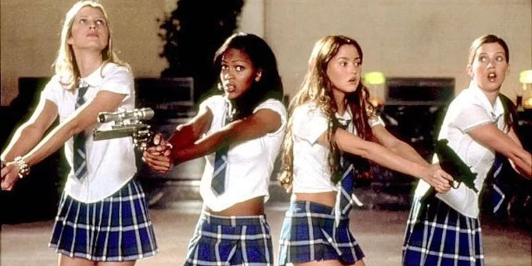 Dominique, Amy, Max, and Janet holding guns in D.E.B.S
