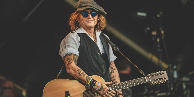 Johnny Depp with his Guitar at a concert