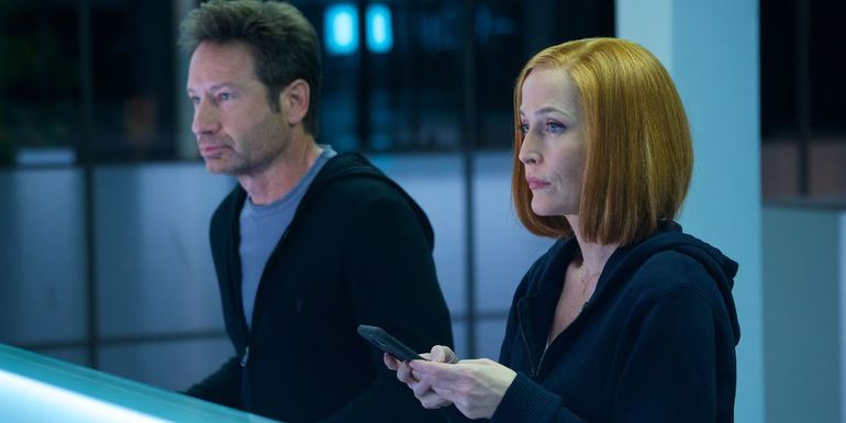 Mulder ad Scully in the X-Files sat in a white room looking bemused