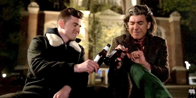 Ted Lasso's Trent Crimm (James Lance) and Colin (Billy Harris) toasting drinks in Amsterdam 