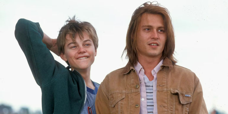Arnie (Leonardo DiCaprio) and Gilbert (Johnny Depp) smiling in What's Eating Gilbert Grape