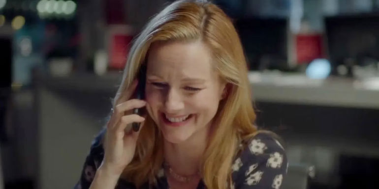 Sarah (Laura Linney) talking on the phone and laughing in Red Nose Day Actually.