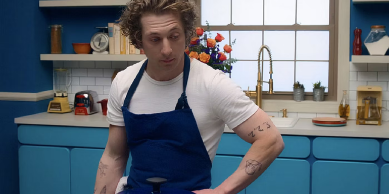 Carmy cooking in the kitchen in The Bear