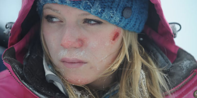 Parker (Emma Bell) frightened on the ski lift in Frozen