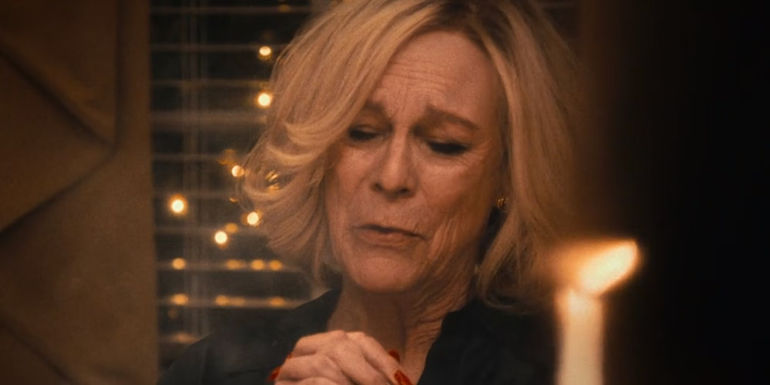 Jamie Lee Curtis as Donna Berzatto sitting at the dinner table in The Bear season 2