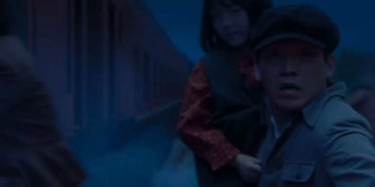 A man and his daughter boarding a train in Gyeongseong Creature episode 7