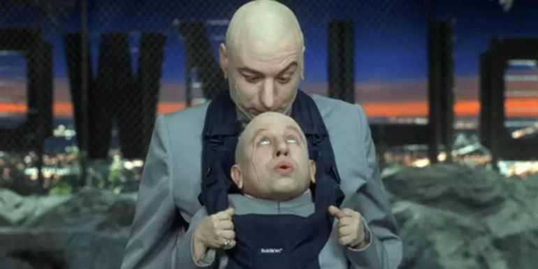 Mike Myers as Dr Evil carrying Mini-Me in a baby carrier in Austin Powers in Goldmember