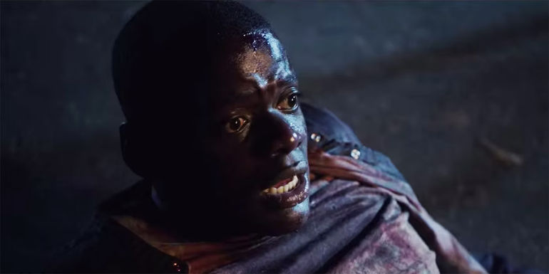 Daniel Kaluuya as Chris on the ground looking scared at the end of Get Out