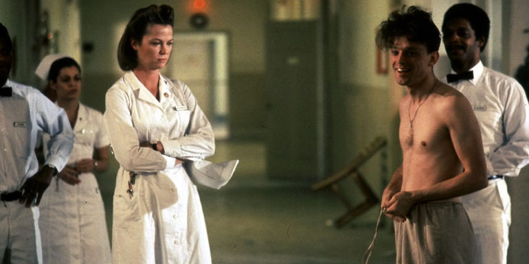 Nursed Ratched (Louise Fletcher) looking unimpressed by a patient in One Flew Over the Cuckoo's Nest.