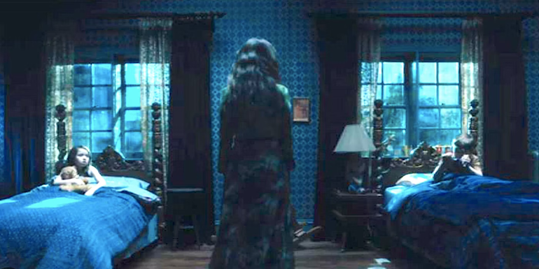 A woman watches the children's bedroom in The Haunting of Hill House