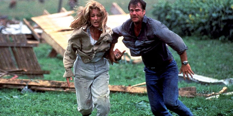 Helen Hunt and Bill Paxton running in Twister