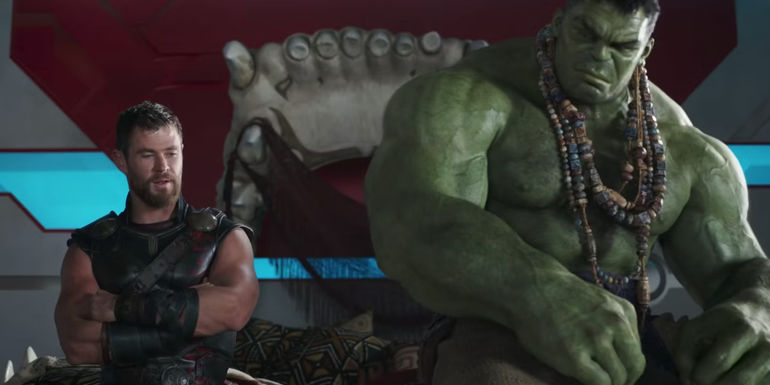 Thor and Hulk sitting next to each other in a living quarters in Thor: Ragnarok