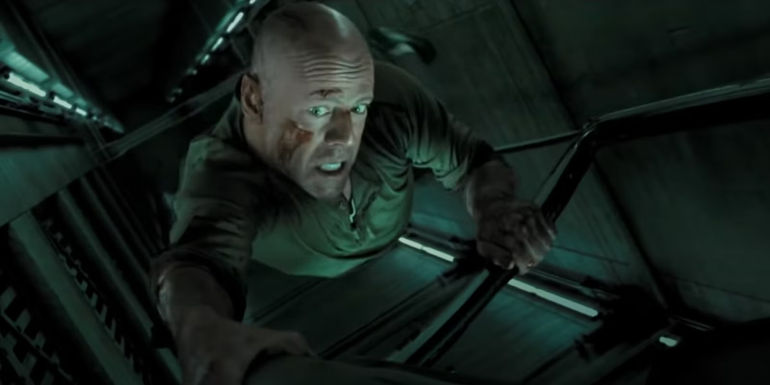 John McClane hanging in an elevator shaft in Live Free or Die Hard