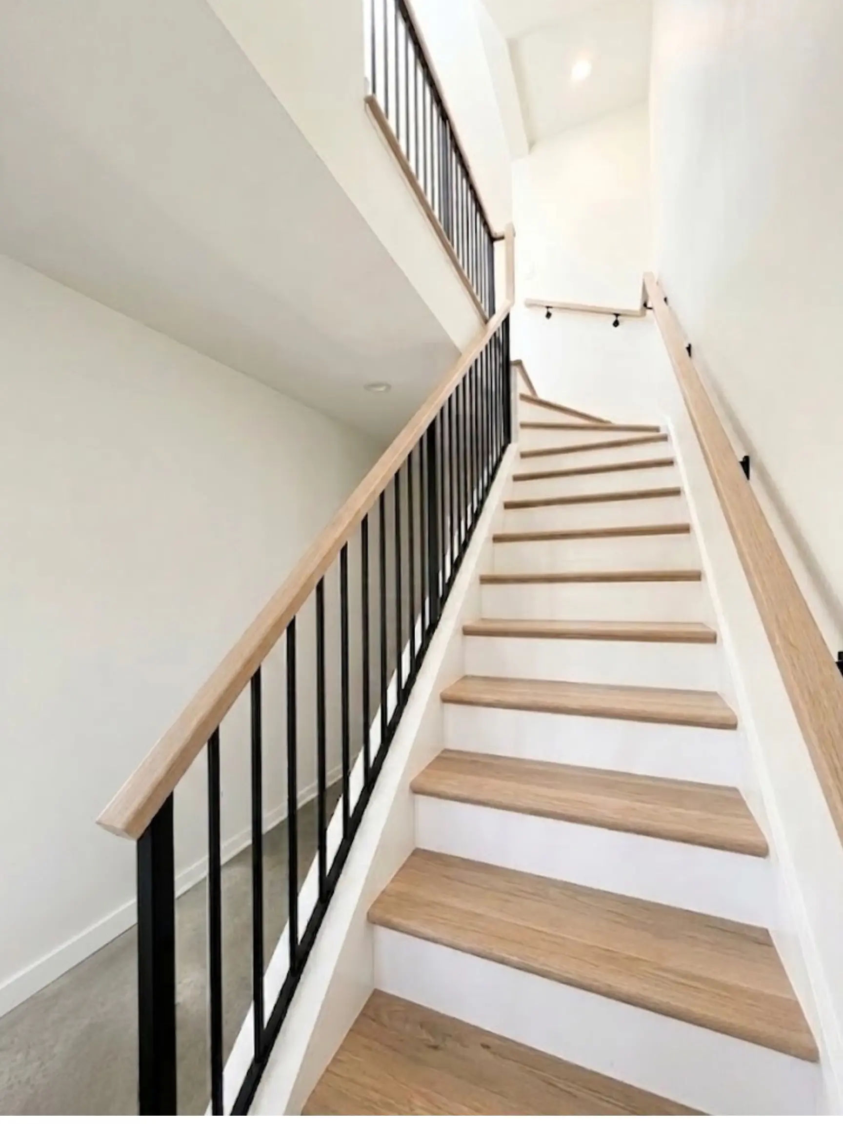 Open-railing staircase remodel in a Chicago home -- Assembly Squad