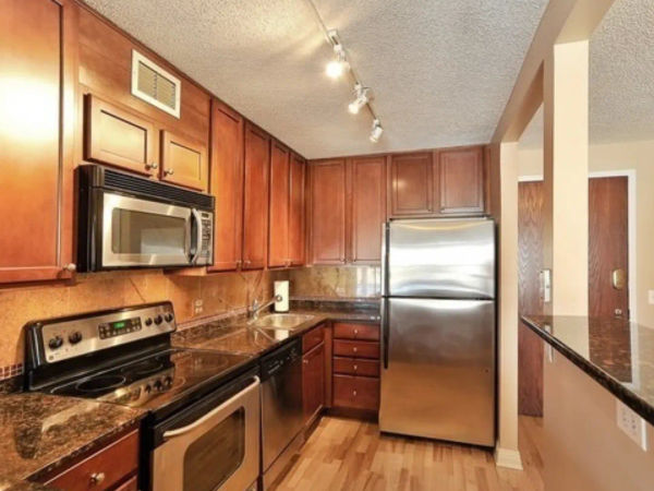 W Belden Ave Lincoln Park kitchen before remodel - dated brown cabinets