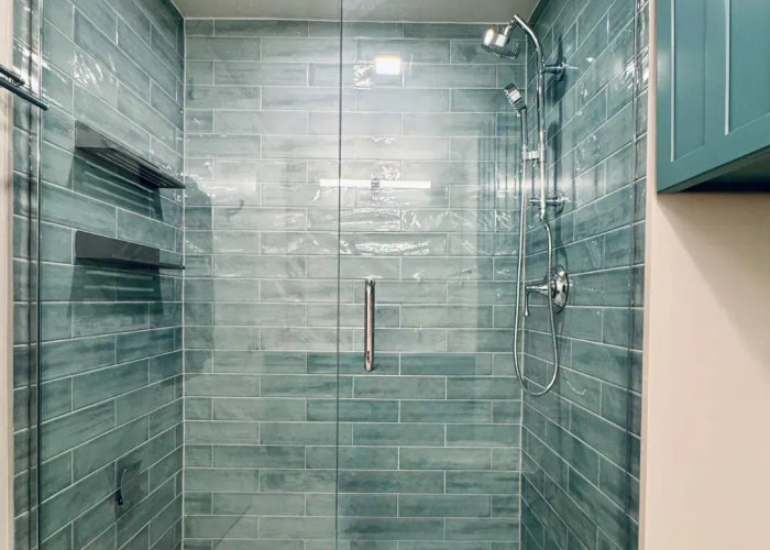 680 Lake Shore Drive Streeterville bathroom after luxury tub-to-shower conversion -- modern teal design walk-in shower