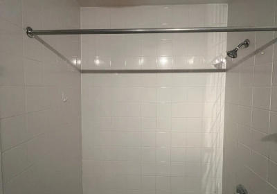 680 N Lake Shore Drive Streeterville bathroom before remodel -- dark black tiles original