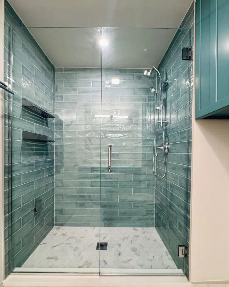Streeterville condo bathroom before renovation -- original dated shower Chicago