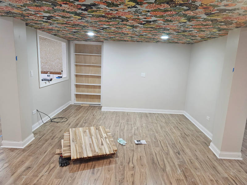 After -- maple hardwood flooring running continuously through the finished basement at Kimmer Court, Lake Forest