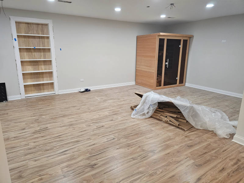 After -- finished basement entertainment area with maple floors at Kimmer Court, Lake Forest