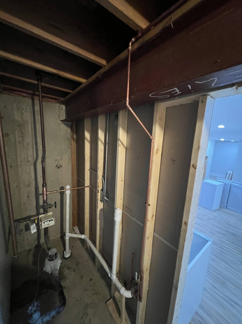 Before -- concrete slab in unfinished basement at Kimmer Court, Lake Forest, before the moisture barrier and subfloor