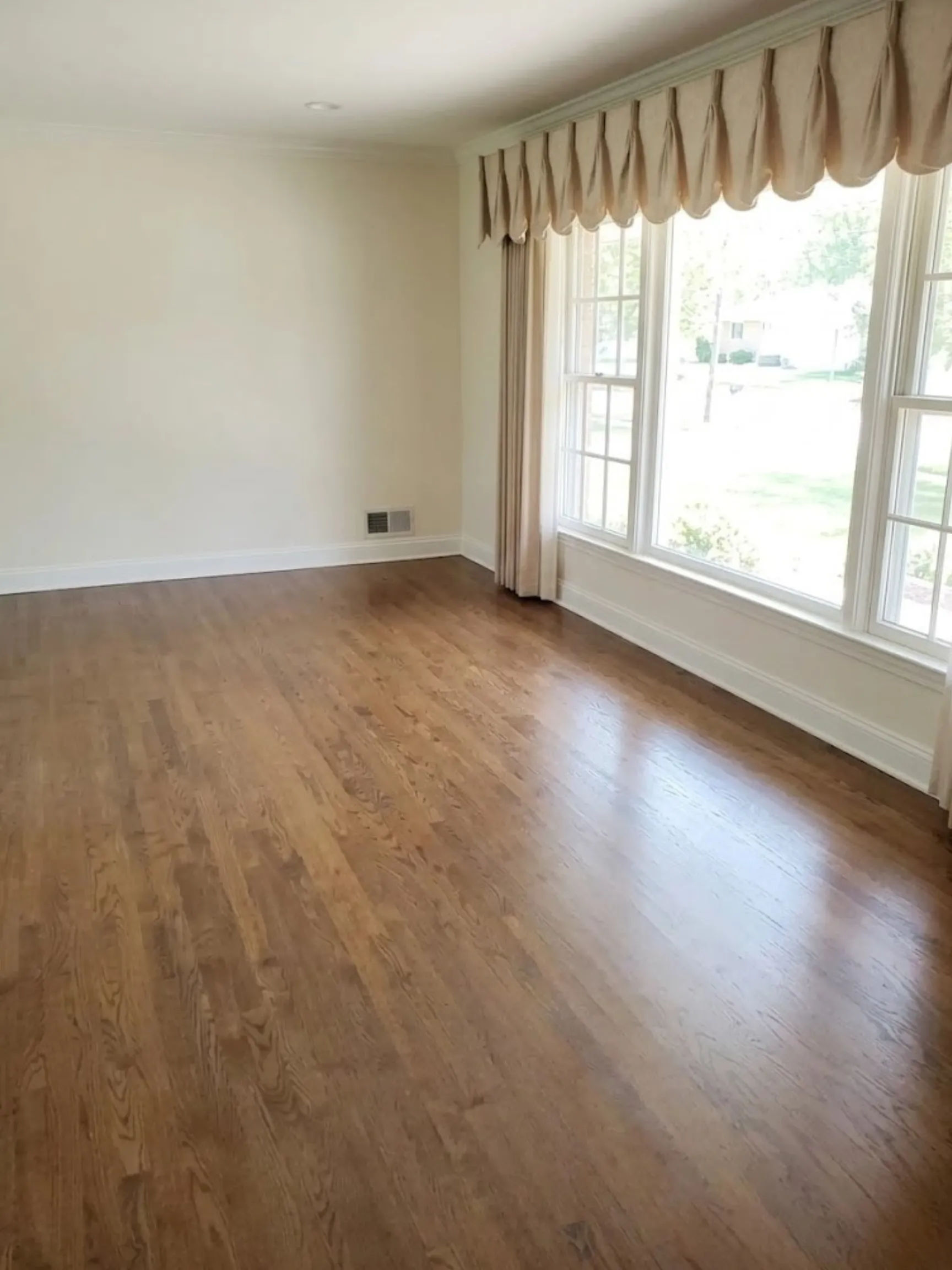 515 W Cedar St Arlington Heights dining room with brass globe chandelier, chair rail, and refinished hardwood floors