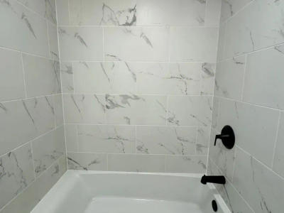 Streeterville bathroom renovation after 111 E Chestnut Chicago 60611 -- new tub vanity toilet waterproofing