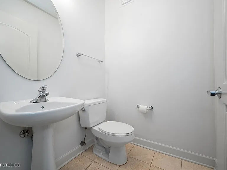 Before -- original powder room with pedestal sink at 450 E Waterside Dr, Unit 510, The Chandler, Lakeshore East, prior to renovation