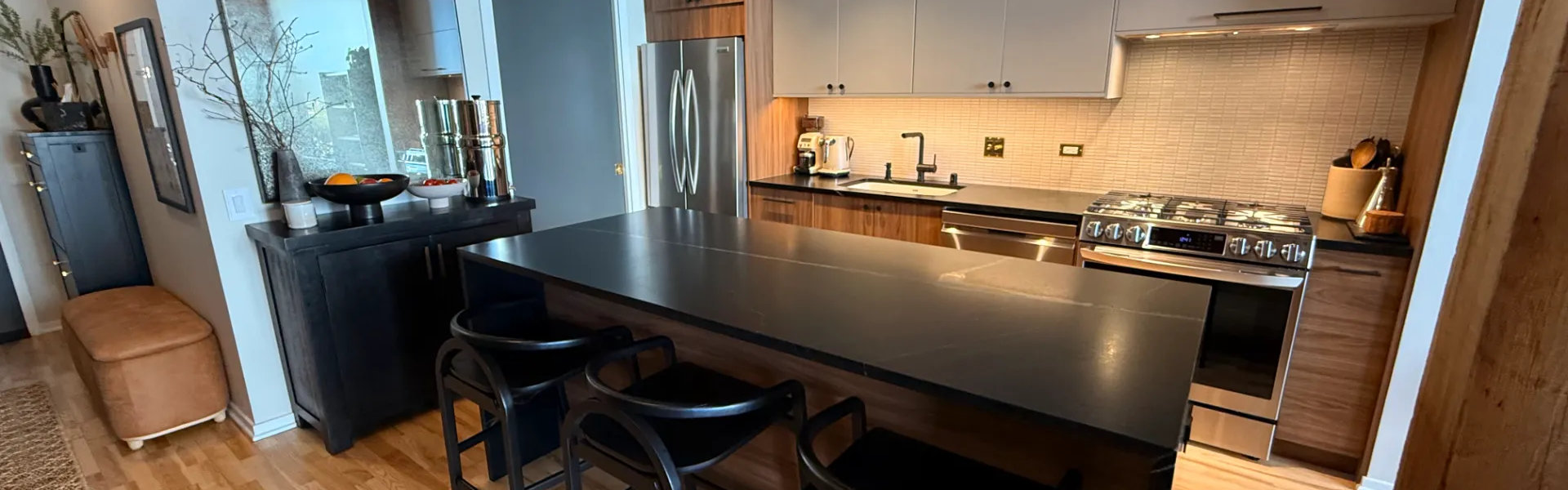 South Loop chef kitchen 1632 S Indiana -- island seating, IKEA cabinets and soapstone countertops, chic modern kitchen remodel Chicago 2026
