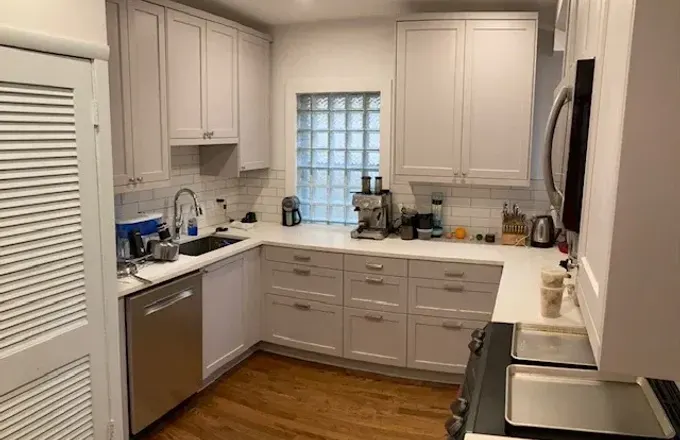 N Magnolia Ave Andersonville 60640 vintage home kitchen remodel by Assembly Squad -- custom cabinets in trending colors, MSI white quartz countertops, designer backsplash tile, bright modern flooring in Chicago