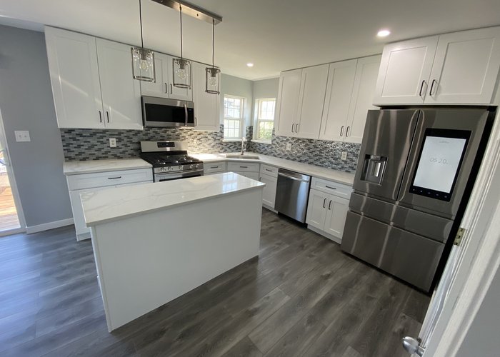 Logan Square kitchen after remodel -- Italian cabinets MSI Tier 1 quartz single-tone modern design Chicago