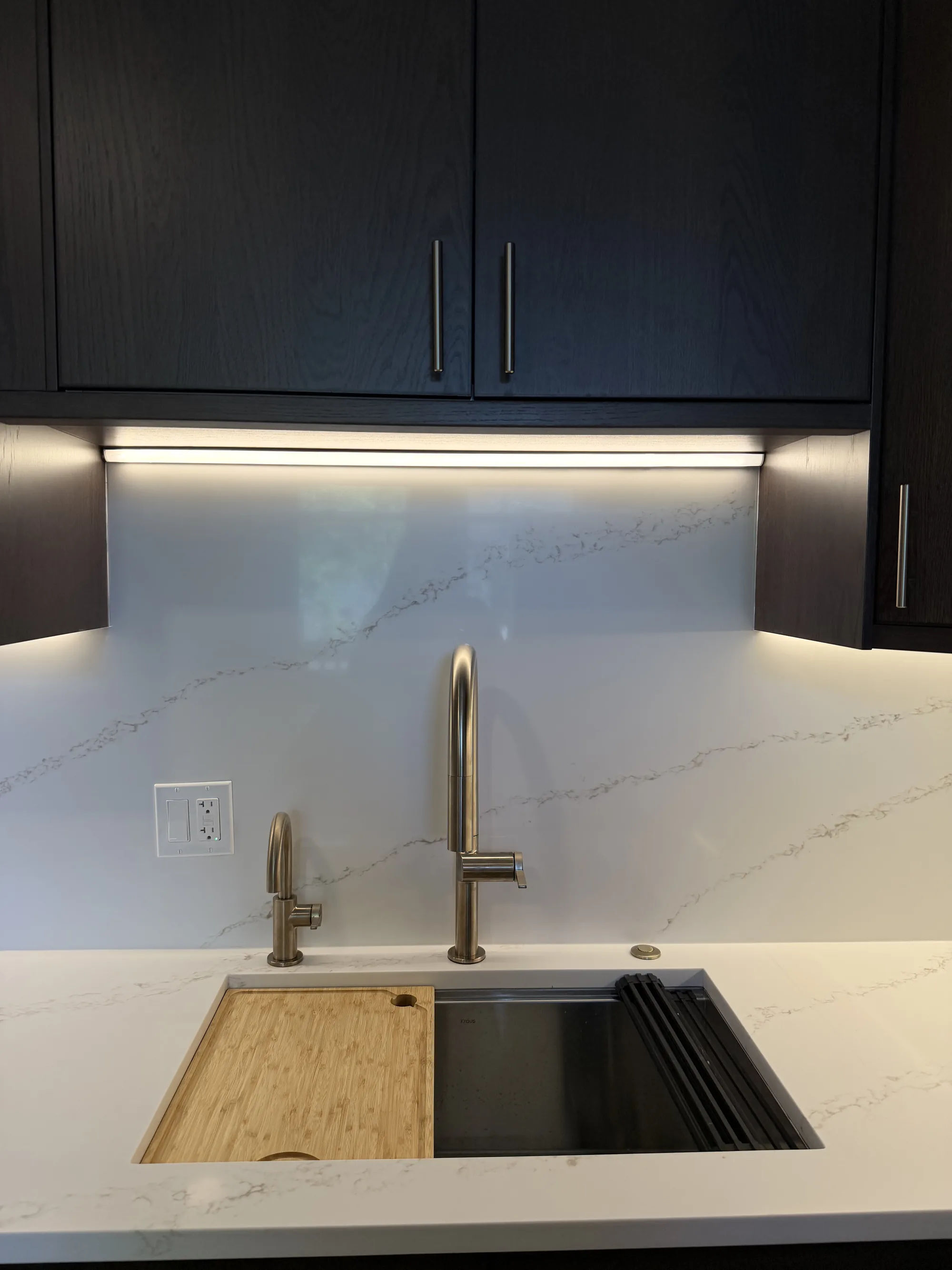 After -- kitchen sink with integrated cutting board and quartz countertop and backsplash at 3054 N Sheffield Ave, Lakeview