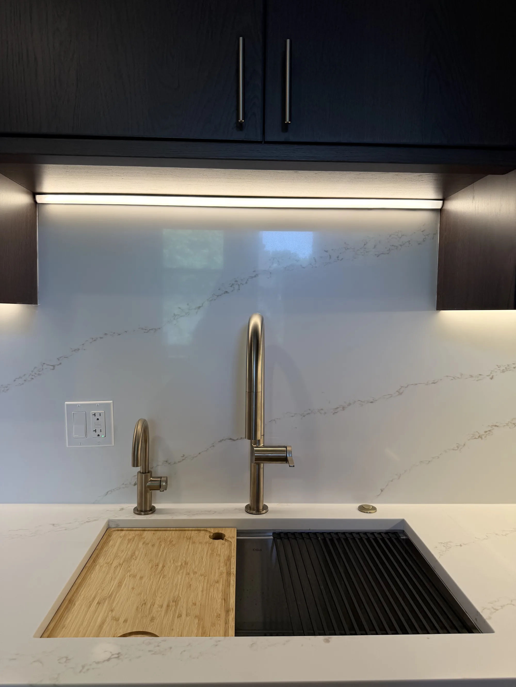 After -- undermount kitchen sink with a gold gooseneck faucet and quartz backsplash at 3054 N Sheffield Ave, Lakeview