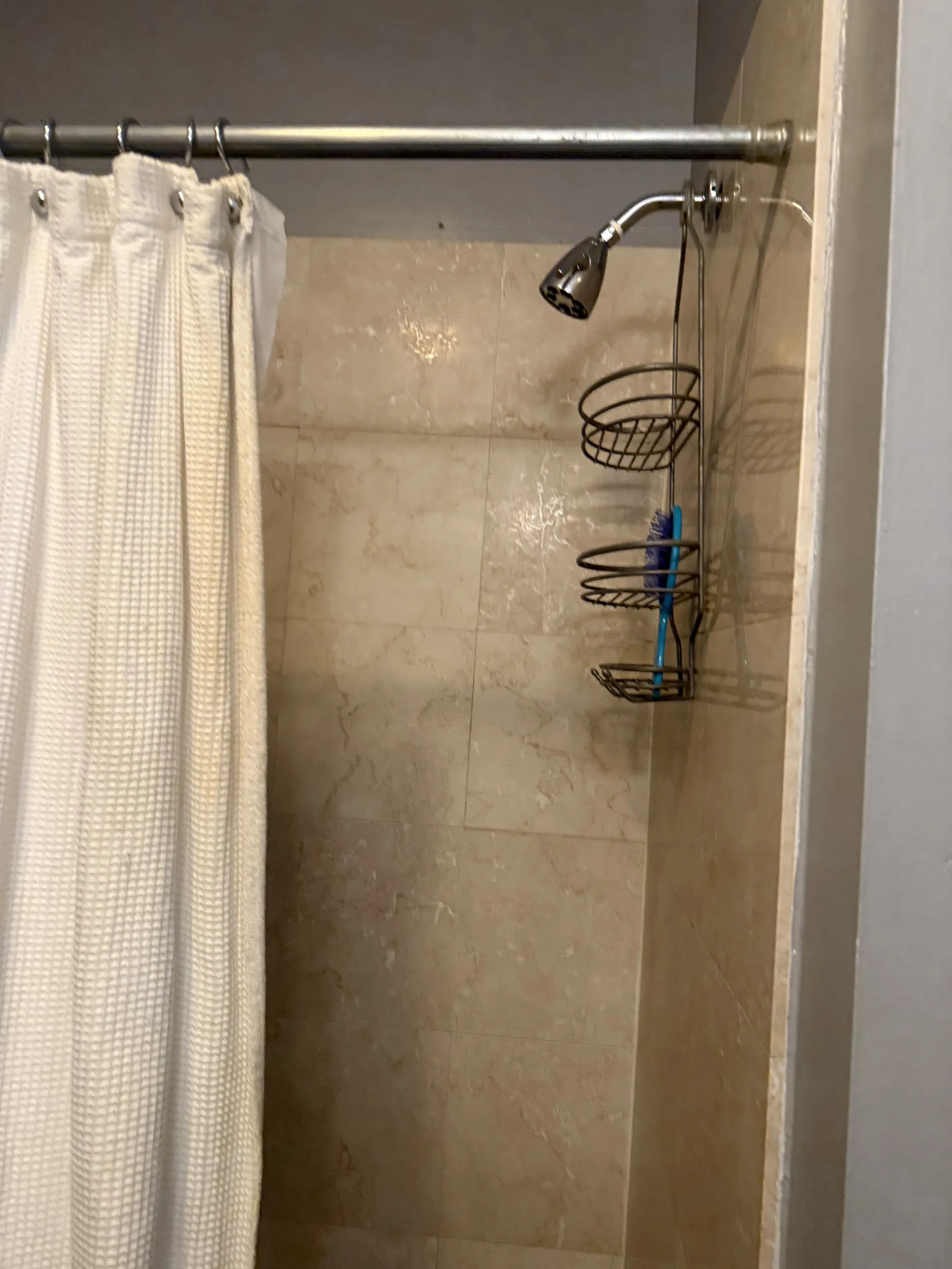 Before -- original bathroom with a tub and shower curtain at 3054 N Sheffield Ave, Lakeview, prior to the walk-in shower conversion