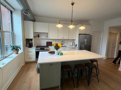 Walnut wood flooring West Loop condo remodel -- throughout kitchen and living room 1001 Madison