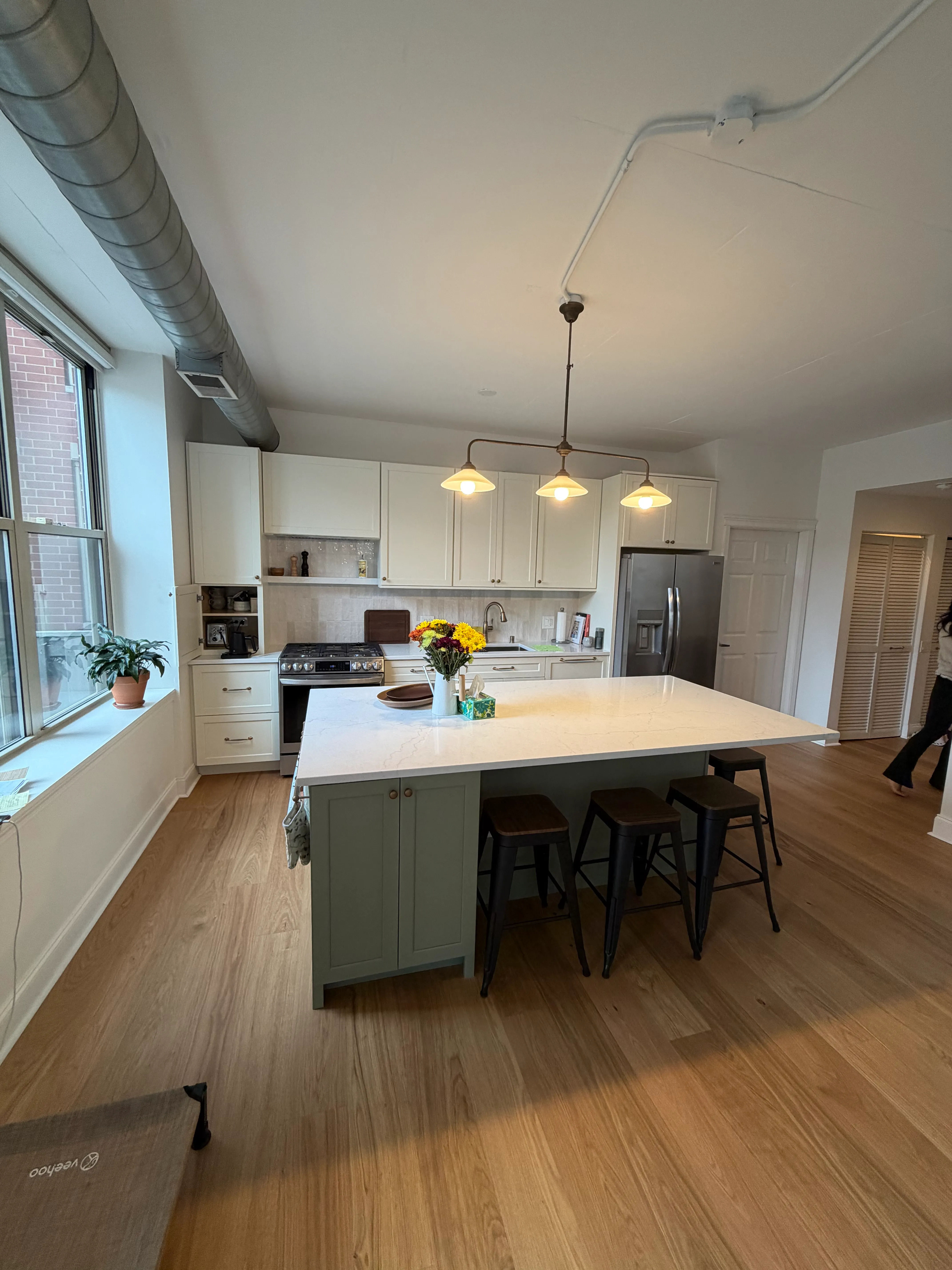 Open concept kitchen layout West Loop loft remodel