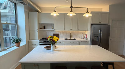 Open concept Streeterville kitchen with lake views by Assembly Squad