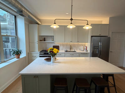 West Loop two-tone cabinet condo kitchen after remodel -- 1001 W Madison St Chicago 60607