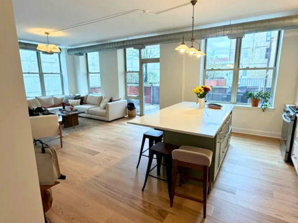 1001 W Madison St West Loop condo after remodel - modern living area with new flooring and paint