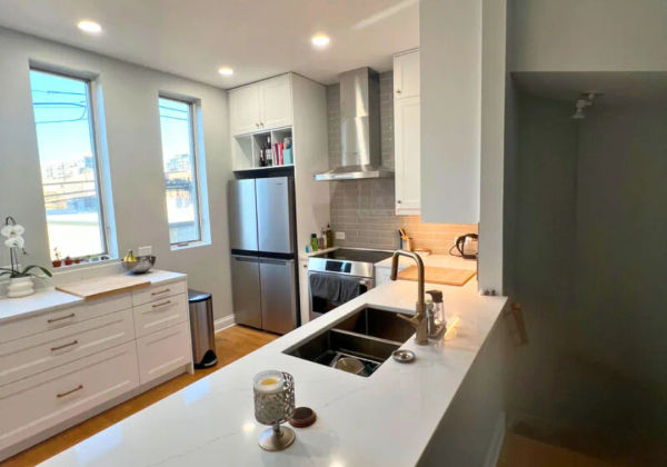 West Loop kitchen remodeling -- open concept with custom Illinois-made cabinets and MSI quartz countertops