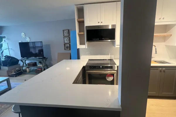 Kitchen after renovation - open concept with island